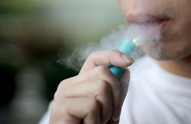 young-man-vaping