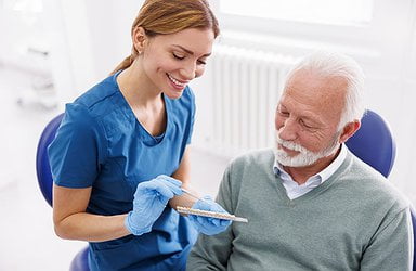 dentist-showing-veneers-to-person-with-diabetes