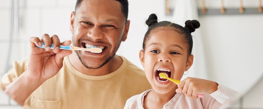 father-and-daughter-brushing-their-teeth