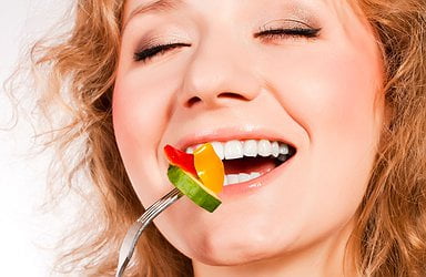woman-eating-healthy-salad-white-teeth