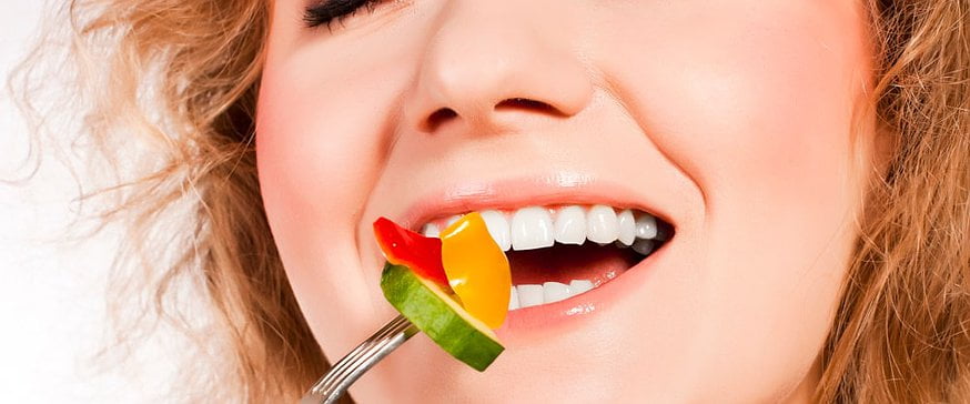 woman-eating-healthy-salad-white-teeth